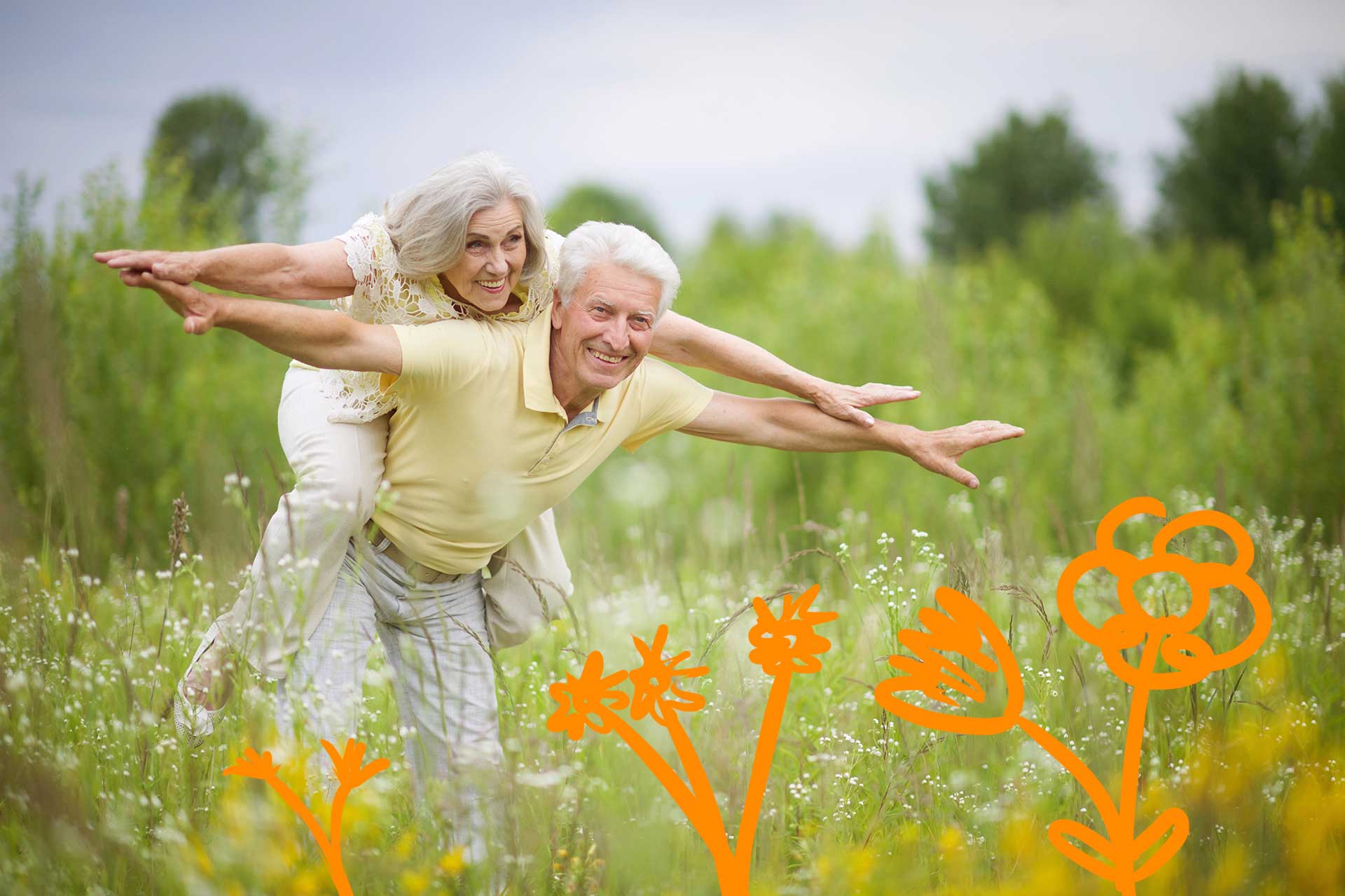 couple de personnes agees dans un champ fleuri au printemps