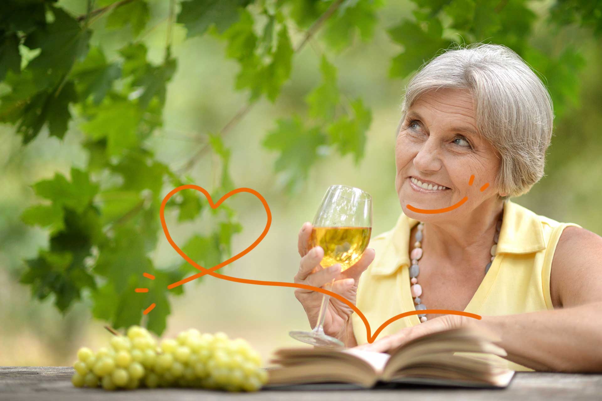 femme agee lisant un livre en cuisinant